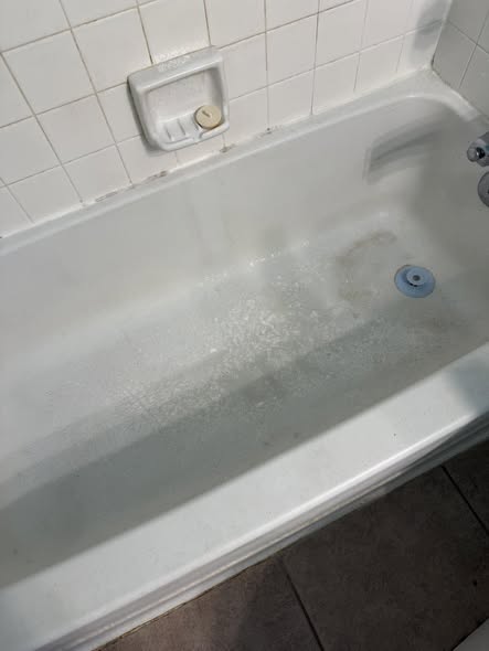 Clean bathtub surface after detail cleaning